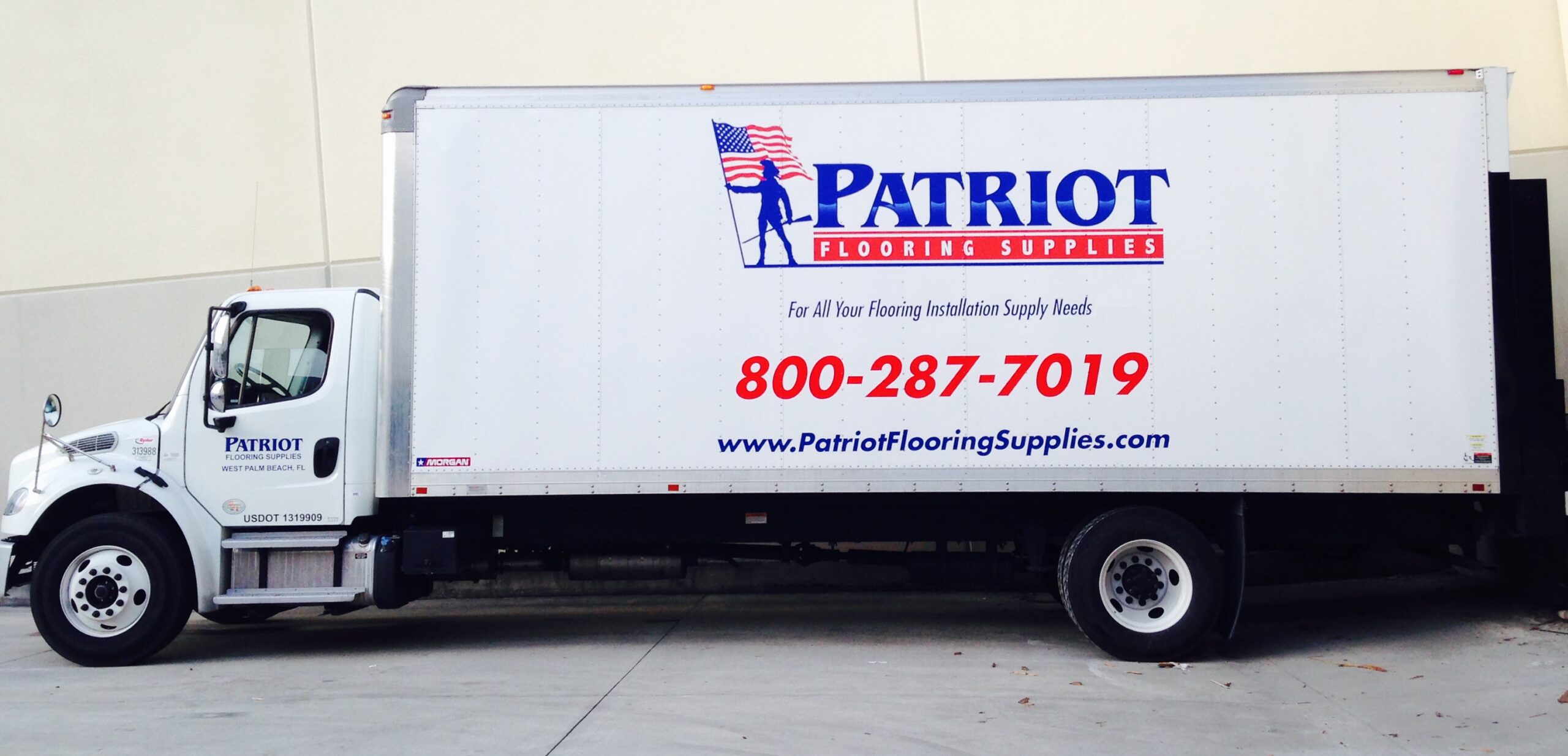 White delivery truck with Patriot Flooring Supplies branding